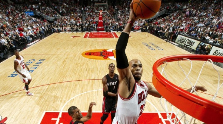 CHICAGO, IL - MARCH 14:  Taj Gibson #22 of the Chicago Bulls goes for a dunk against the Miami Heat on March 14, 2012 at the United Center in Chicago, Illinois. NOTE TO USER:  User expressly acknowledges and agrees that, by downloading and or using this Photograph, user is consenting to the terms and conditions of the Getty Images License Agreement.  Mandatory Copyright Notice:  Copyright 2012 NBAE (Photo by Joe Murphy/NBAE via Getty Images)