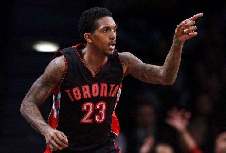Toronto Raptors' Lou Williams (23) reacts after scoring against the Brooklyn Nets during overtime of an NBA basketball game Friday, Jan. 30, 2015, in New York.Toronto defeated Brooklyn 127-122 in overtime. (AP Photo/Jason DeCrow)